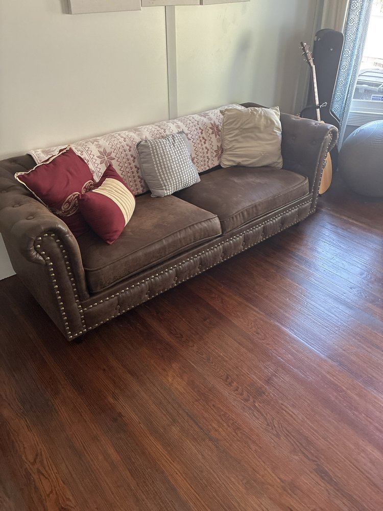 Clean living room with detailed hardwood floors