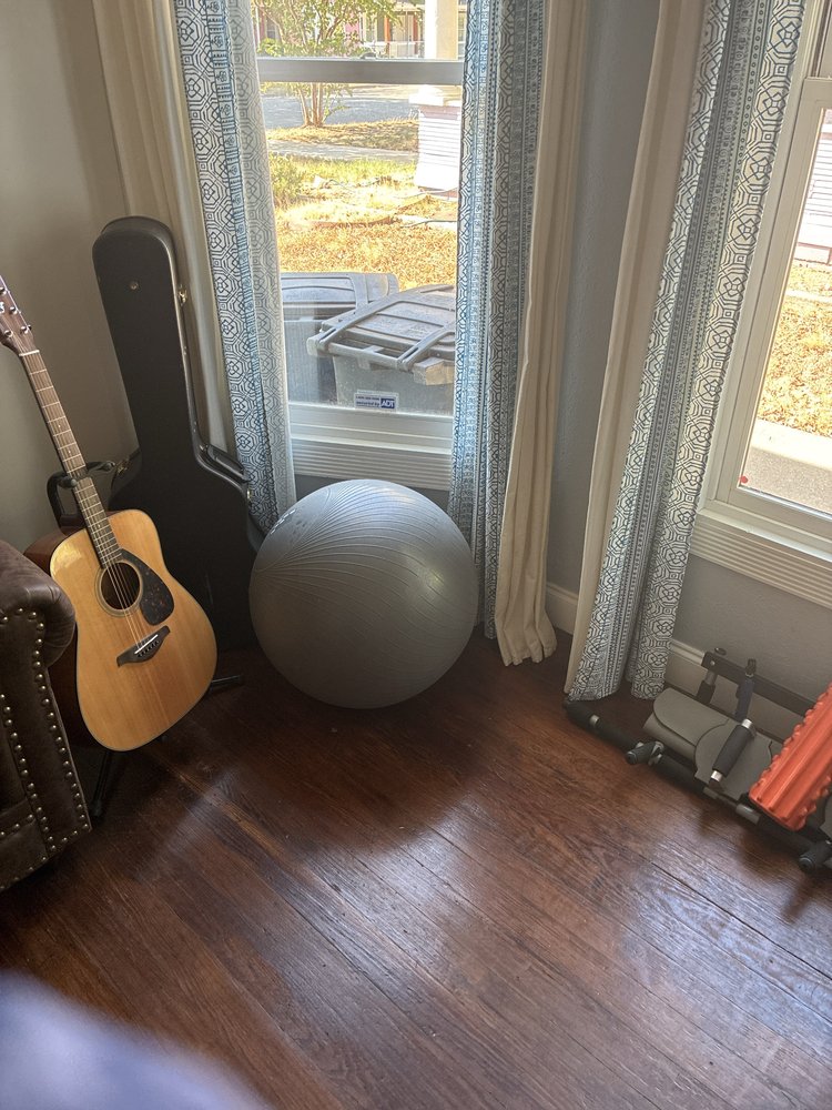 Clean living room corner with gleaming floors